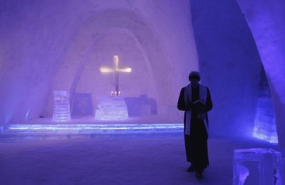 A Catholic priest walks inside a church made of snow in the Bavarian village of Mitterfirmiansreut, near the German-Czech border, December 28, 2011. The snow church is likely to become a tourist attraction till the beginning of spring.