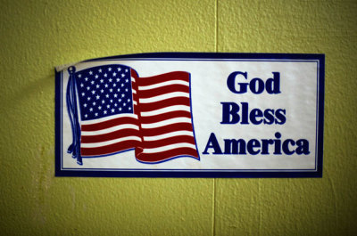 A decal reading 'God Bless America' is seen on the wall of the soup kitchen in the basement of the St. Leo Catholic Church in Detroit December 17, 2011.