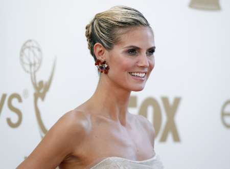 Model and host Heidi Klum from television 'Project Runway' arrives at the 63rd Primetime Emmy Awards in Los Angeles September 18, 2011.