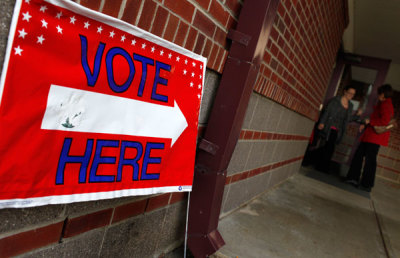 Voters enter a polling station in Nashua, New Hampshire, January 10, 2012. Voters in New Hampshire went to the polls Tuesday in the first in the nation presidential primary election.