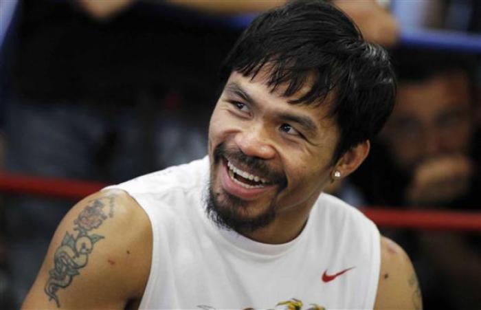 Boxer Manny Pacquiao smiles during a media workout at Wild Card Boxing Club in Los Angeles, Calif., Oct. 26, 2011.