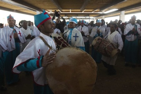 Eritrean Orthodox Christian pilgrims chant during a ceremony at the baptismal site known as Qasr el-Yahud on the banks of the Jordan River near the West Bank city of Jericho January 19, 2012.