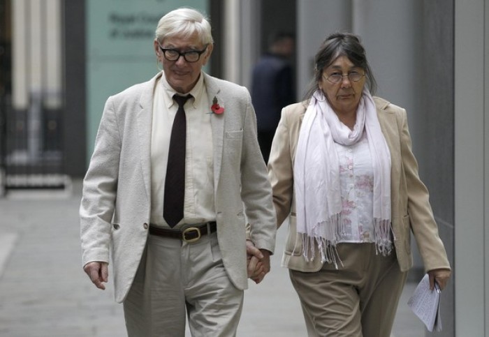 Hotel owners Peter and Hazelmary Bull walk outside a branch of the High Court in central London, November 8, 2011. The devout Christian hotel owners are appealing after they were told to pay damages for banning a gay couple from sharing a double room and are insisting at the appeal court that they should have been allowed to impose the ban, according to local media reports.