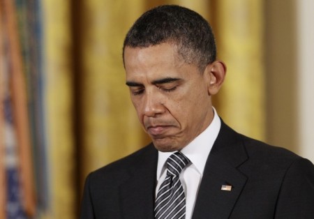 President Barack Obama bows his head in prayer in this May 2, 2011, file photo.