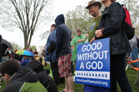 Nontheists hold a sign while attending the Reason Rally in Washington, D.C., Saturday, March 24, 2012.