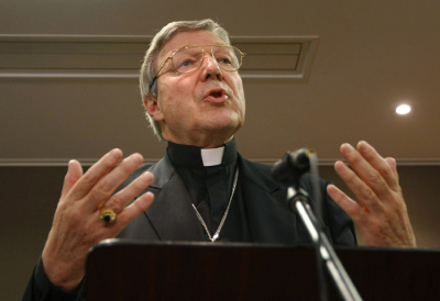 Catholic cardinal George Pell of Australia answers questions at a news conference.