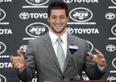 New York Jets quarterback Tim Tebow speaks at a news conference introducing him as a Jets at the team's training center in Florham Park, New Jersey March 26, 2012.