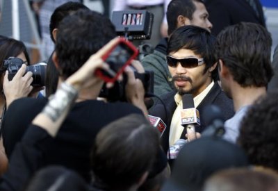 Congressman and boxer Manny Pacquiao of the Philippines, and the evening's guest host, speaks during an interview at the North American premiere of the Filipino film 'The Road' at the Arclight Hollywood Theater in Los Angeles May 9, 2012.