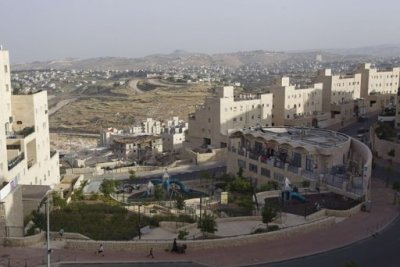 A general view shows Palestinian villages (rear) around a Jewish settlement near Jerusalem known to Israelis as Har Homa and to Palestinians as Jabal Abu Ghneim April 25, 2012. Har Homa is a terraced suburb of neat, white-stone apartments housing 13,000 Israelis that overlooks the biblical town of Bethlehem. Picture taken April 25, 2012.