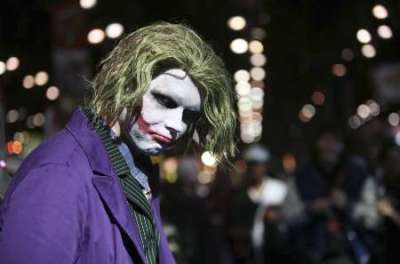 A man dressed as the Joker from the movie Dark Knight poses for a picture at the New York Comic Con February 7, 2009. The convention, held from February 6-8, showcases the latest in comics, graphic novels, anime, manga, video games, toys, movies, and television.