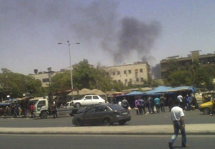 Residents, who have fled their homes, gather in the center of Damascus July 19, 2012. Rebels seized control of sections of Syria's international borders and torched the main police headquarters in the heart of old Damascus, advancing relentlessly after the assassination of President Bashar al-Assad's closest lieutenants.