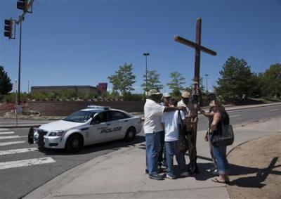 Prayer vigils such as this one and others at churches statewide in Colorado on Friday were held for the victims of a mass shooting that killed 12 people at a midnight premiere of the new 'Batman' movie in Aurora, Colo., July 20, 2012.