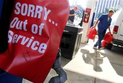 Covered gas pumps are seen as residents head to the pumps in preparation for Tropical Storm Issac in Metairie, La., Aug. 27, 2012.