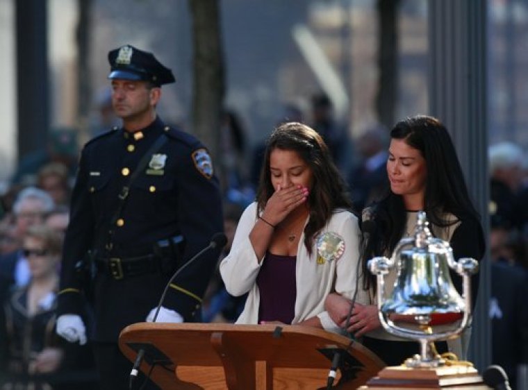 A reader breaks down in tears while reading victims' names during ceremonies marking the 11th anniversary of the September 11 attacks on the World Trade Center, in New York, September 11, 2012.