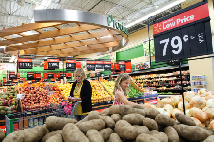 Customers shop at a Wal-Mart Neighborhood Market store in Bentonville, Arkansas, May 31, 2012.