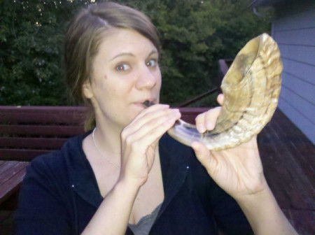 Author Rachel Held Evans lived one year of Biblical womanhood for her new book. In this photo, she is blowing into a shofar.