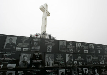 The Mount Soledad cross stands over memorials from the National War Memorial in Ja Jolla, California May 11, 2006.