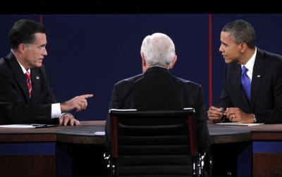 U.S. Republican presidential nominee Mitt Romney (L) makes a point while answering a question from moderator Bob Schieffer (C) as U.S. President Barack Obama listens during the final U.S. presidential debate in Boca Raton, Florida, October 22, 2012.