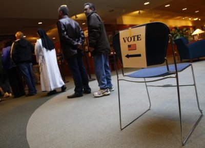 People stand in line to vote during the U.S. presidential election in Janesville, Wisconsin November 6, 2012.