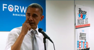 President Barack Obama wipes a tear as he gives a brief talk to campaign staff and volunteers at the Chicago office, Nov. 7, 2012.