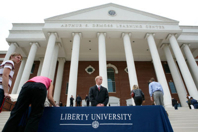 Mourners sign the book of condolence outside of the Arthur S. DeMoss Learing Center where the body of Reverend Jerry Falwell lies in repose at Liberty University in Lynchburg, VA, May 17, 2007. U.S. evangelist Jerry Falwell, who helped turn the religious right into a powerful political force and fired controversy with his battles against abortion and homosexuality, died on Tuesday at age 73.