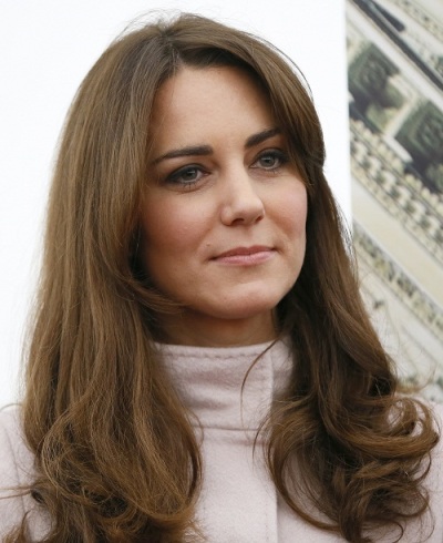 Britain's Catherine, Duchess of Cambridge listens to her husband Prince William deliver a speech during a visit to Cambridge University in Cambridge, central England November 28, 2012.