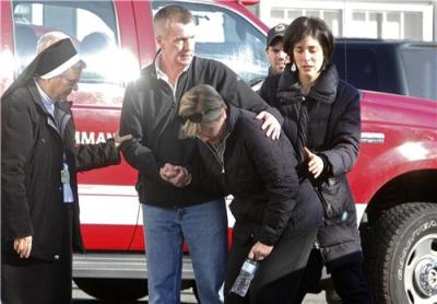 Relatives react outside Sandy Hook Elementary School following a shooting in Newtown, Conn., Dec. 14, 2012.