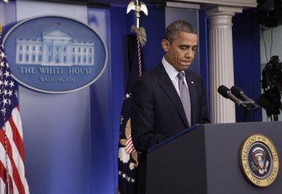 U.S. President Barack Obama pauses as he makes an statement about the shooting at Sandy Hook Elementary School in Newtown, Connecticut, during a press briefing at the White House in Washington, D.C. on Friday, Dec. 14, 2012.