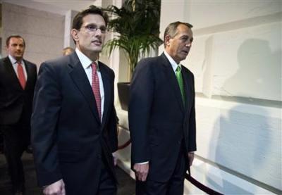 Speaker of the House John Boehner (R-OH) walks with House Majority Leader Rep. Eric Cantor (R-VA) to a meeting with House Republicans on the 'fiscal cliff' budget deal on Capitol Hill in Washington on January 1, 2013. Washington's last-minute scramble to step back from a 'fiscal cliff' ran into trouble on Tuesday as Republicans in the House of Representatives balked at a deal to avert a budget crisis.