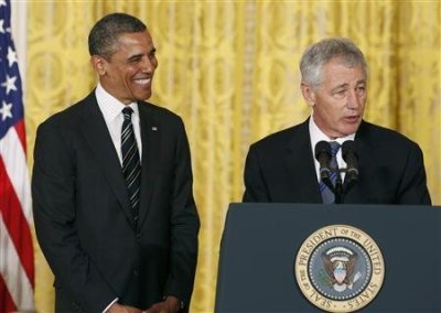 U.S. President Barack Obama smiles at his nominee for Secretary of Defense, former Republican Senator Chuck Hagel (R), at the White House in Washington January 7, 2013.