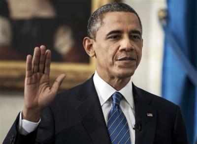 U.S. President Barack Obama is sworn in for a second term as President of the United States in the Blue Room of the White House in Washington, DC January 20, 2013.