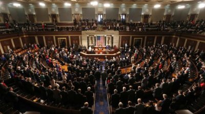 Members of the 113th Congress bow their heads in prayer as they convene in the Capitol in Washington January 3, 2013. In the wake of bruising fights in their own ranks over the 'fiscal cliff' and aid for victims of superstorm Sandy - Republicans in the U.S. House of Representatives open a new Congress on Thursday more divided than ever.