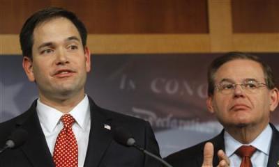 Senators Robert Menendez (D-NJ) (R) and Marco Rubio attend a news conference on comprehensive immigration reform at the U.S. Capitol in Washington January 28, 2013.