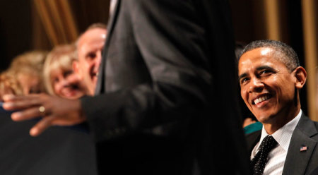 U.S. President Barack Obama listens to keynote speaker Dr. Benjamin Carson at the National Prayer Breakfast in Washington February 7, 2013.