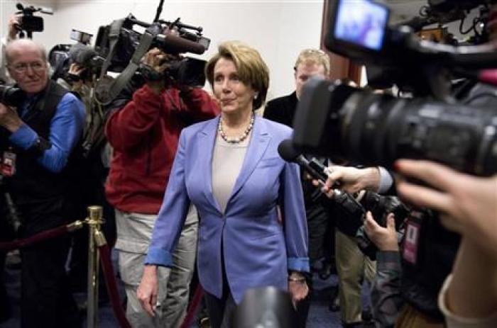 U.S. House Minority Leader Nancy Pelosi (D-CA) arrives to meet with House Democrats and U.S. Vice President Joseph Biden about a solution for the ''fiscal cliff'' on Capitol Hill in Washington January 1, 2013.