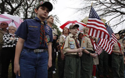 A crowd of Scouts, parents and supporters gather during a prayer vigil at the Boy Scouts of America headquarters in Irving, Texas, February 6, 2013. The Boy Scouts of America on Wednesday delayed until May a vote on whether to end a controversial ban on gay members, drawing praise and rebukes from the two sides of a heated debate that has drawn in politicians as well as parents.