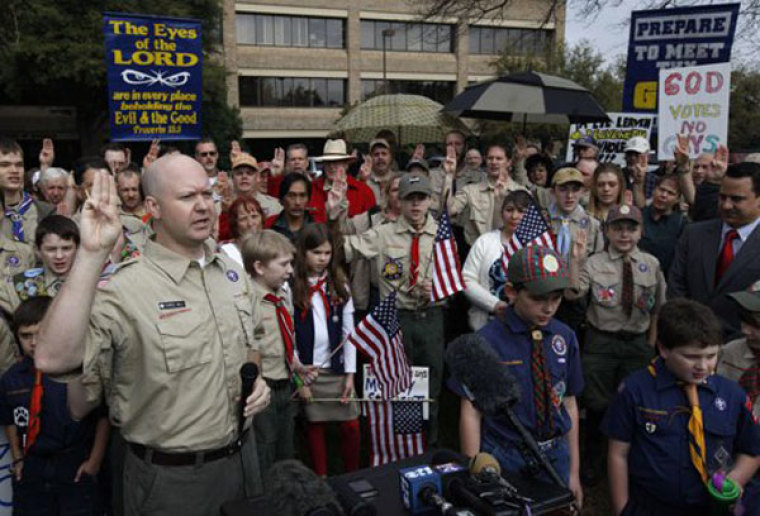 Chris Hill leads the crowd in the Boy Scout Oath during a prayer vigil at the Boy Scouts of America headquarters in Irving, Texas, February 6, 2013.