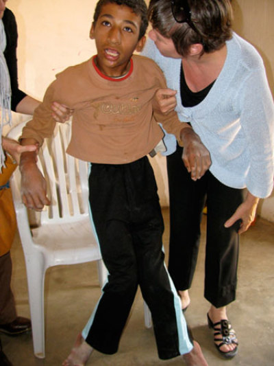 16-year-old crippled boy who has never had a wheelchair and is pulled around with rope due to illness.