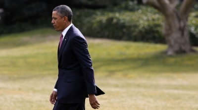 U.S. President Barack Obama walks on the South Lawn of the White House in Washington March 5, 2013.