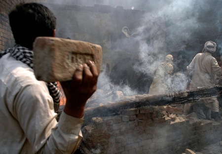 Police only looked on as homes, shops and churches were destroyed in Lahore.