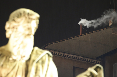 White smoke rises from the chimney above the Sistine Chapel in the Vatican, indicating a new pope has been elected at the Vatican March 13, 2013. White smoke rose from the Sistine Chapel and the bells of St. Peter's Basilica rang out on Wednesday, signaling that Roman Catholic cardinals elected a pope to succeed Benedict XVI.