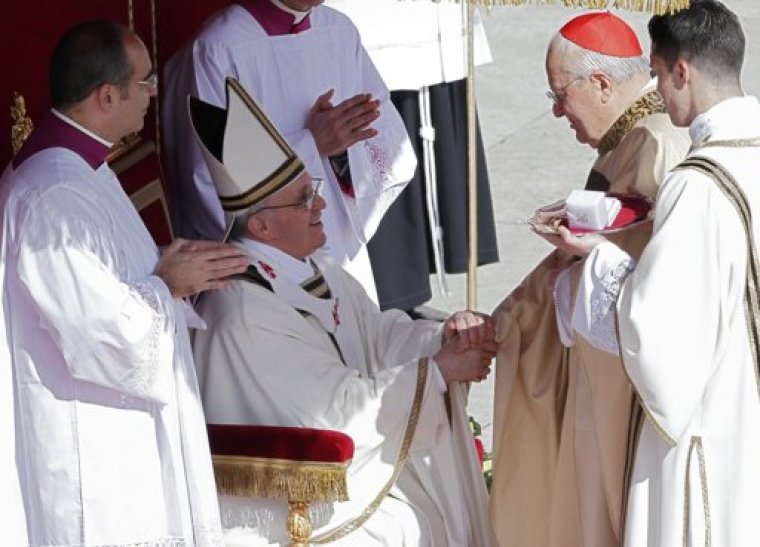 Pope Francis shakes the hand of Cardinal Angelo Sodano (2nd R), Dean of the College of Cardinals after he had placed the Fisherman's Ring on his finger, during his inaugural mass at the Vatican, March 19, 2013. Pope Francis celebrates his inaugural mass on Tuesday among political and religious leaders from around the world and amid a wave of hope for a renewal of the scandal-plagued Roman Catholic Church.