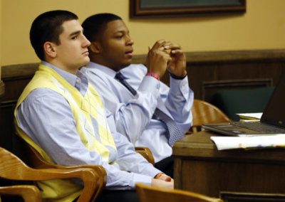 Trent Mays, left, and Ma'lik Richmond, right, sit in juvenile court during a recess in Steubenville, Ohio, on March 14, 2013.