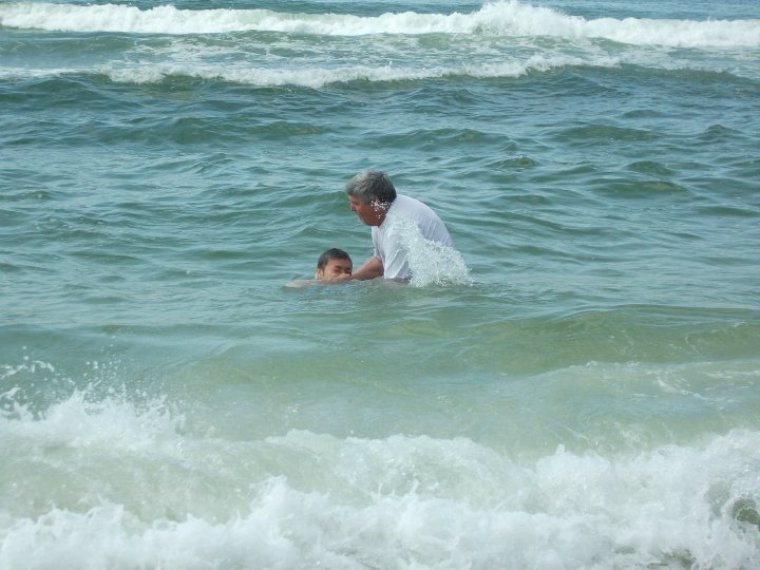 Pastor Mike Young performs a baptism after an Easter Sunday service on the green in Rosemary Beach, Fla.