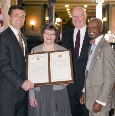 Sen. Will Longwitz, left, presents Dr. Hannah Gay, second from left, University of Mississippi Medical Center associate professor of pediatrics, with a plaque on Tuesday, March 19, congratulating her for her work in functionally curing a child infected with HIV. Dr. James Keeton, third from left, UMMC vice chancellor for health affairs, and Sen. Hillman Frazier, right, accompanied Gay at the Mississippi Capitol. On the Senate floor, Longwitz introduced a resolution to honor Gay that was signed by House Speaker Philip Gunn and Lt. Gov. Tate Reeves.