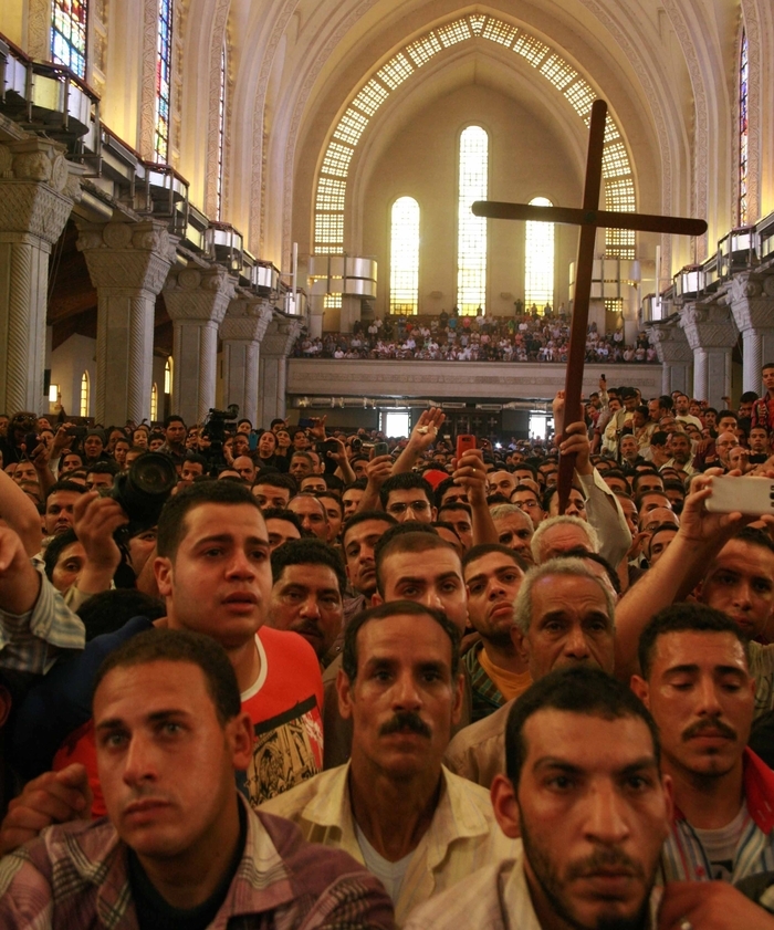 Mourners at St. Mark’s Coptic Orthodox Cathedral for funeral of four slain Christians.