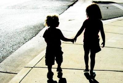 Two children photographed to celebrate National Siblings Day.