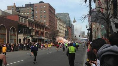 Picture captures man walking on roof near explosions