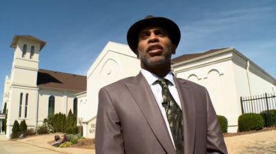 Lloyd Hawk, chairman of the board of trustees at Friendship Baptist Church, a 150-year-old historic black church in Atlanta, Ga., speaking to WXIA-TV about the controversial decision they and members of Mt. Vernon Baptist Church will be making if they decide to relocate to make way for the new $1 billion Falcons football stadium in Atlanta, Ga., March 10, 2013.