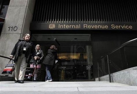 Women walk out of an Internal Revenue Service office in New York, April 18, 2011.